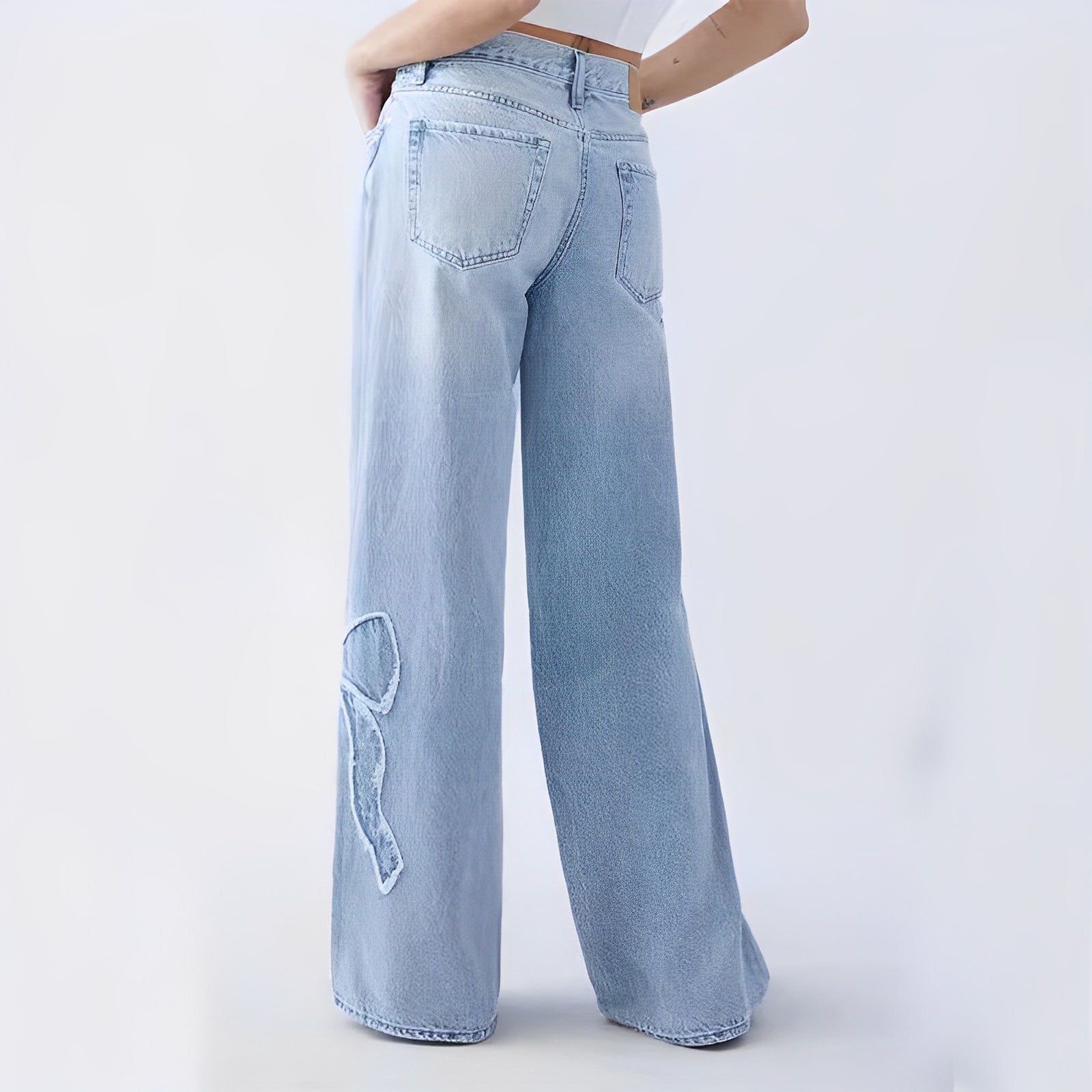 Wide-Leg Denim with Embroidered Bow Detail – Soft Blue Wash
